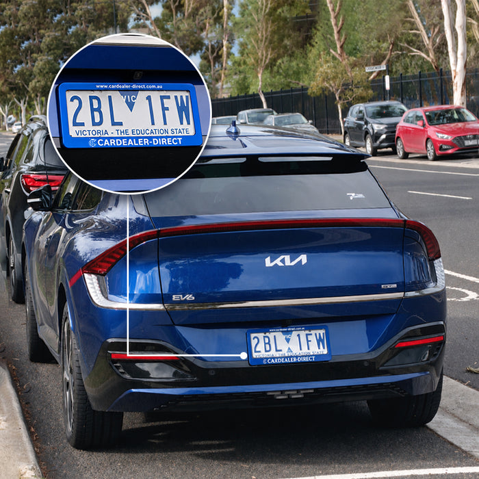 Blue branded number plate frame fitted to an Australian vehicle