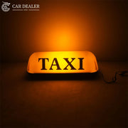 12V illuminated magnetic TAXI sign installed on a car roof