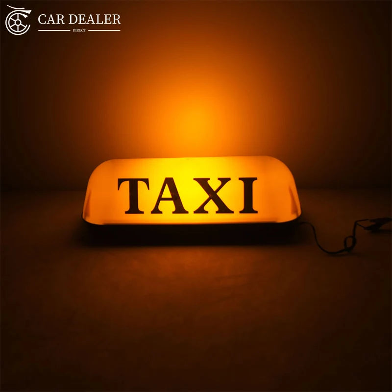 12V illuminated magnetic TAXI sign installed on a car roof